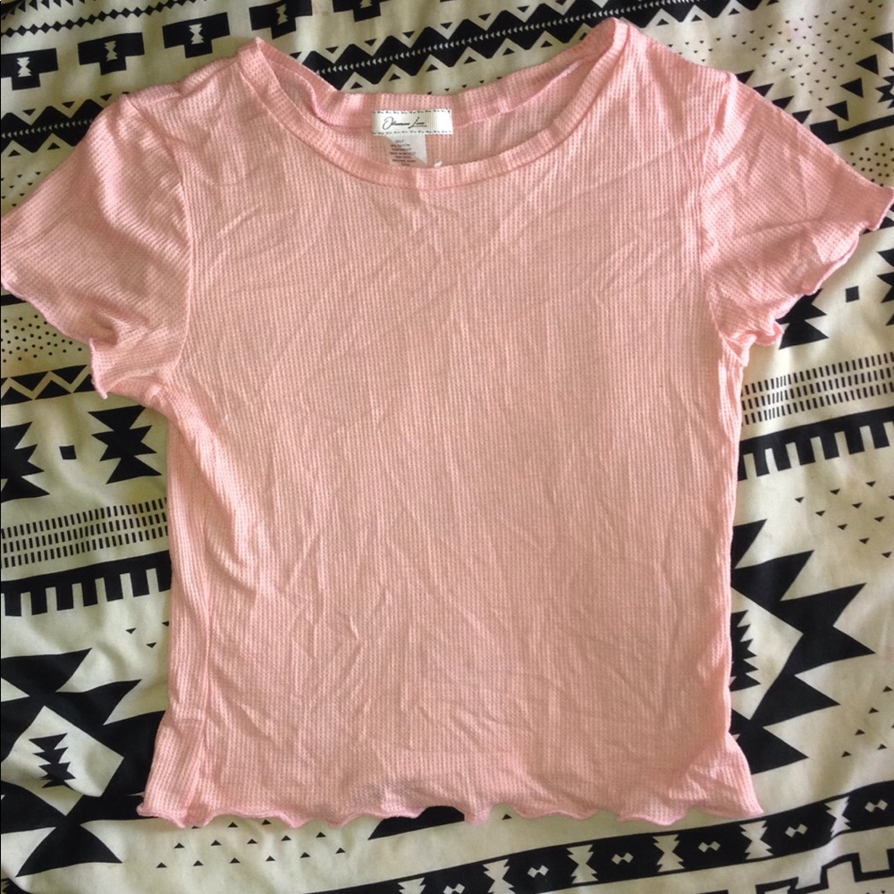 Pink ruffled sleeve crop top.